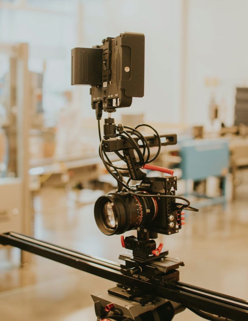 A crew checking camera positions and lighting on a television studio floor